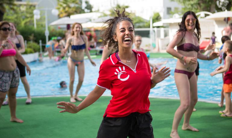 Poolside fun with people dancing and enjoying themselves.